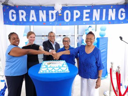 From left, directors Sonia Richards Malcolm, Shannon Boorman-Vaz, Dr Edward Chung, Helen Christian and Linda Woolery cut the celebratory cake at the July 14 ribbon-cutting ceremony marking the opening of Biomedical’s Drax Hall Collection Centre in St Ann
