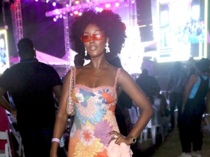 Davene Jonas, fashion designer and owner of Davene Jonas Beauty, is lilies-in-the-valley chic in a lace-strap maxi dress.
