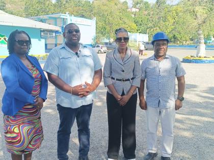 Parliamentary Secretary in the Ministry of Education, Skills, Youth and Information, Senator Marlon Morgan (second left), engages with stakeholders at the Ocho Rios Primary School in St Ann on Monday, August 24. Looking on is Principal Suzette Barnes-Wilso