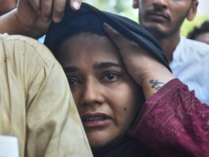 A woman, who lost her baby in a hospital fire, reacts at a hospital in Islamabad, Pakistan, Wednesday.