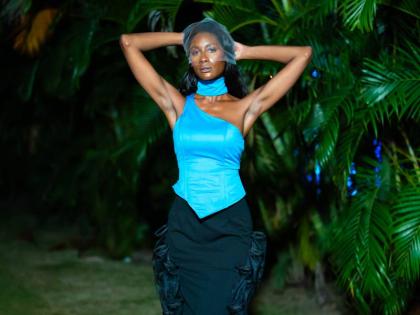 Ashlie Barrett mixes things up in a bright-blue corset top, textured black skirt and matching statement boots. 