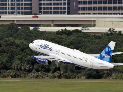 FILE - A JetBlue Airways Airbus A320-232 takes off from the Tampa International Airport in Tampa, Fla., May 15, 2014 (AP Photo/Chris O'Meara, File)