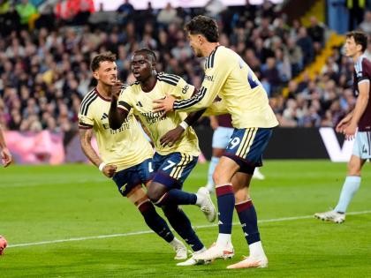 Arsenal's Bukayo Saka (7) celebrates after scoring his side's opening goal during the English Premier League soccer match between Aston Villa and Arsenal in Birmingham, England, Monday, Aug. 31, 2026. (Nick Potts/PA via AP)
