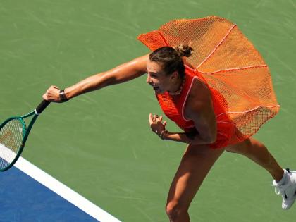 Aryna Sabalenka, of Belarus, follows through on a shot to Camila Osorio, of Colombia, during the first round of the U.S. Open tennis championships, yesterday, in New York. 