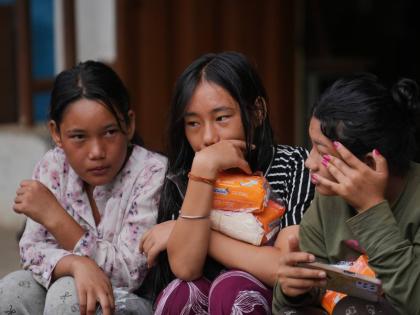 Displaced girls sit at a school converted into a temporary shelter for displaced residents in residents in Bidur, in Nepal’s Nuwakot district, on Tuesday, September 1.
