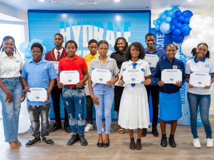 Jusanna Staple (left), brand coordinator, WATA Portfolio, Wisynco Group Ltd, shares a moment with Hydrate to Educate student awardees during the WATA Hydrate to Educate Awards Luncheon at the S Hotel in Montego Bay on Wednesday, August 26. Sharing the mome
