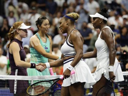
Venus (right) and Serena Williams (centre), of the United States, congratulate Maya Joint (left) of Australia, and Hao-Ching Chan, of Taiwan, after their women’s doubles match at the US Open tennis championships on Friday.