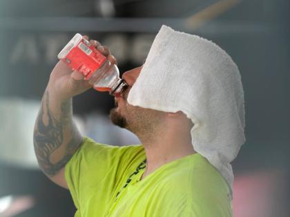 A construction worker hydrates at the Shedd Aquarium, on a hot day in Chicago.