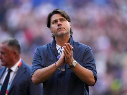 United States head coach Mauricio Pochettino walks off the field after the United States lost a World Cup round-of-16 football match against Belgium in Seattle, July 6.