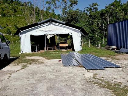 Sheets of zinc lay on the grounds of Carisbrook Primary and Infant School as repair work continues.  
