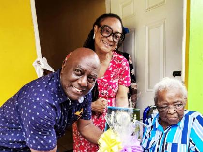 Councillor Lloyd Garrick (left) of the Moneague Division, Chairman of the Civic Affairs and Community Relations Committee Councillor Genevor Gordon-Bailey (centre), and centenarian Ilsa Maud Hinds, during a recognition visit at her home in Faith’s Pen, M