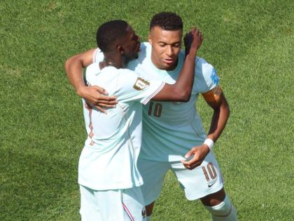 France’s Kylian Mbappe (right) and Ousmane Dembele celebrate after scoring during the World Cup Group I football match against Norway in Foxborough, Massechusetts, near Boston on Friday, June 26.