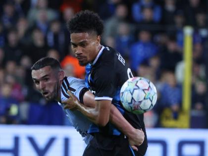 Aston Villa’s John McGinn (left) battles for the ball with Brugge’s Felix Lemarechal during the Champions League opening phase football match in Bruges, Belgium, yesterday.