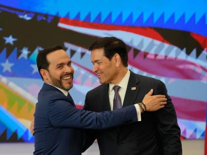 Colombian President Abelardo De La Espriella (left) and US Secretary of State Marco Rubio embrace during a bilateral agreement signing ceremony in Barranquilla, Colombia, Tuesday.