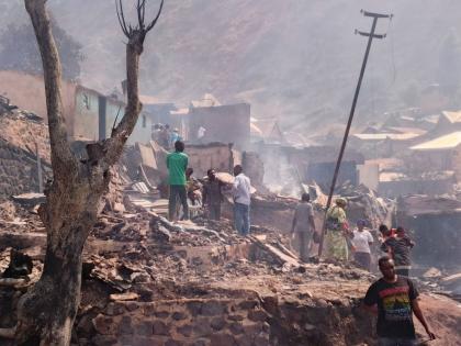 People walk through smoke after a fire at a school killed several people in Bukavu, Congo, Thursday, Sept. 10, 2026. (AP Photo/Janvier Barhahiga)
