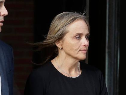 District Court Judge Shelley Joseph departs federal court, April 25, 2019, in Boston. 