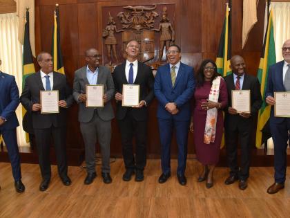 Prime Minister Dr Andrew Holness (fourth right), Cabinet Secretary Audrey Sewell (third right), and Ambassador Antony Anderson (left), CEO, National Reconstruction and Resilience Authority, share a moment with members of the Jamaica Reconstruction and Resi