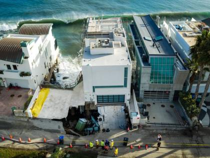 An aerial view of a sinkhole which collapsed the driveway of a coastal mansion owned by actor Nicolas Cage on Tuesday, in Malibu, California.