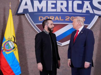 President Donald Trump greets El Salvador’s President Nayib Bukele (left) at the Shield of the Americas Summit, March 7, at Trump National Doral Miami in Doral, Florida.