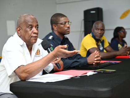 Minister of State in the Ministry of Agriculture, Fisheries and Mining, Franklyn Witter (left), fields questions at the Clarendon Praedial Larceny Farmer Sensitisation Meeting at the Denbigh Showground in the parish on September 9. Others pictured (from se