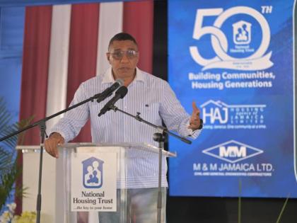Prime Minister Dr Andrew Holness speaking at the groundbreaking at the National Housing Trust’s Bernard Lodge Housing Development in St Catherine on Friday. 