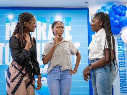 Jusanna Staple (right), brand coordinator, WATA Portfolio, Wisynco Group Ltd, speaks with Jodean Henry of William Knibb Memorial High School and her teacher, Sanese McLeod, during the WATA Hydrate to Educate Awards Luncheon at the S Hotel in Montego Bay on