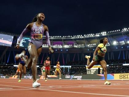 Kayle White (left) of the United States crosses the line just ahead of  Jamaica’s Jonielle Smith in the mixed relay final at the Ultimate Championship  in Budapest, Hungary yesterday. 