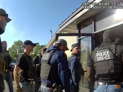 AP 
This image from Homeland Security Investigations body camera video shows federal authorities entering the Nutrition Bar Confectioners plant in Cato, New York on September 4, 2025. 