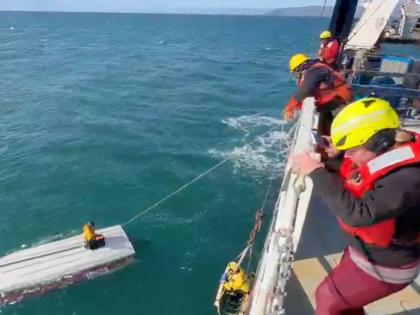 AP 
This image taken from video provided by Carlos Alexis Escartin shows a teenager being rescued by a fishing vessel Monday, September 7, 2026, in the Bering Sea near St Lawrence Island, Alaska.