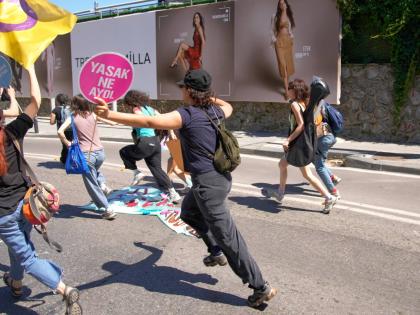 People run from the police during a march in support of transgender people and their rights during the LGBTQ Pride week, in Istanbul, Turkey, on June 21.