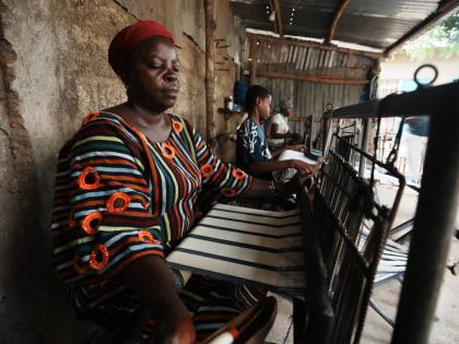 Chabi Baké, a mother of five, weaves in Parakou, northern Benin, Saturday, May 16, 2026. 