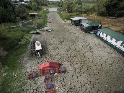 Boats sit on dry ground as water levels have dropped on the Danube River in Petrovaradin, Serbia, on August 25, 2026.