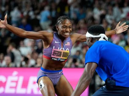 Melissa Jefferson-Wooden, of the United States, celebrates with sprinter Kenneth Bednarek, also of the United States, after winning the women’s 200 metres final at the World Athletics Ultimate Championship in Budapest, Hungary, yesterday,