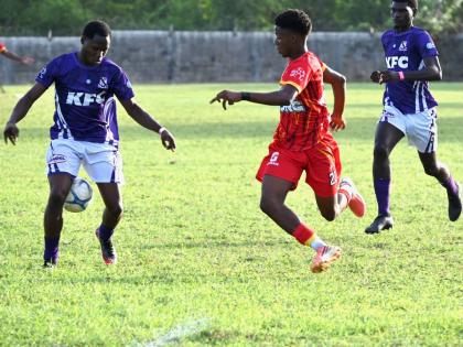 Kingston College’s Rodney Grandstand (left) is challenged by Cornwall College’s Shakeem Gibson (centre) as Kingston College’s Ricardo Gibbon looks on during their ISSA Super Saturday Festival match at Cornwall College on September 12, 2026.