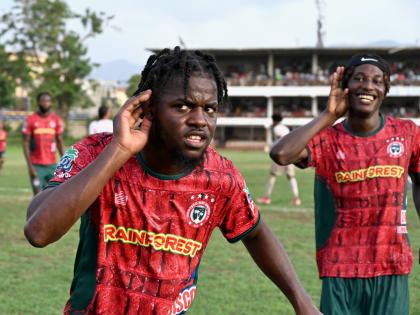 Montego Bay United’s Dwight Merrick (left) and teammate Deonjay Brown  celebrate a goal during their Jamaica Premier League match against Chapelton Maroons at Jarrett Park yesterday. 
