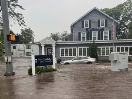 This photo provided by Westport Fire Department shows flash flooding in Westport, Conn., Sunday, Sept. 13, 2026. (Jennifer Petrosinelli/Westport Fire Department via AP)