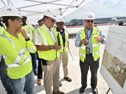 From left: Country Manager of Cemex Jamaica and Managing Director of Carib Cement, Jorge Martinez; Minister of Energy, Transport and Telecommunications, Daryl Vaz; and Airports Authority of Jamaica Chairman, Dr Douglas Lindo listen as PAC Kingston Airport 