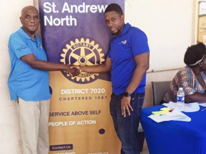Vermont Murray (left), project manager of the Good Samaritan Inn, shares a moment with Patrick Forrest, president of the Rotary Club of St Andrew North, during the Back-to-School Health Fair at the Inn’s drop-in centre on September 6. Through a partnersh