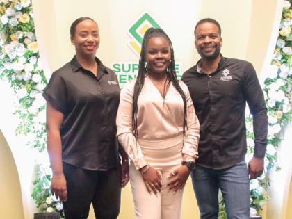 Scholarship recipient Teshauna Lewis (centre) stands alongside Krista-Gaye Fisher (left), CEO of Supreme Ventures Services Limited, and Stefan Miller, CEO of Supreme Ventures Gaming. They attended the launch of the Supreme Ventures Foundation’s scholarsh