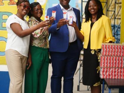  Members of the Naggo Head Infant School community display boxes of Nutri+ Milk during the handover on Friday, September 4. Pictured are Joylyn Fuller-Hunter;  Shanika Clarke-Cown; Rodain Richardson, chairman; and Sophia Francis, Principal. Nutri+ Milk has
