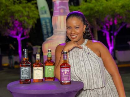 Kimberlee Rose, brand manager for Jack Daniel’s at Caribbean Producers Jamaica Limited, showcases the brand’s portfolio at the Jamaican launch of Jack Daniel’s Tennessee Blackberry at TGI Fridays in St Andrew on August 28.