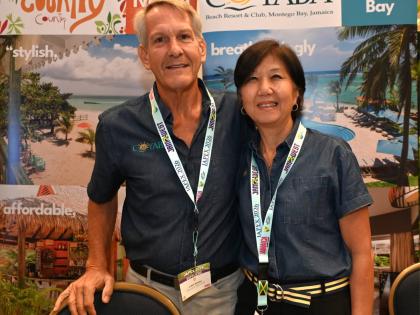 Kevin and Joanne Robertson, owners of Coyaba Beach Resort & Club in Montego Bay, pose in the exhibition hall during Day 2 at Jamaica Product Exchange (JAPEX) at the Moon Palace Jamaica on Tuesday.