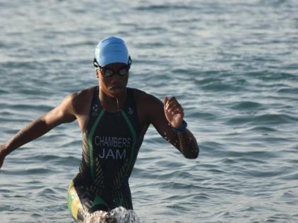 Jamaica Triathlete Kristof Chambers makes a dash to the shoreline during the Carifta Trials on July 19.