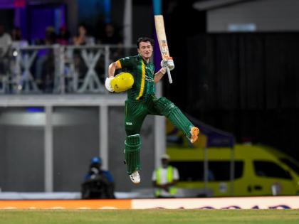 Jamaica Kinsmen batsman Maaz Sadaqat leaps in celebration of scoring a century against the Barbados Tridents in a Republic Bank Caribbean Premier League eliminator at the Kensington Oval in Barbados earlier tonight. 