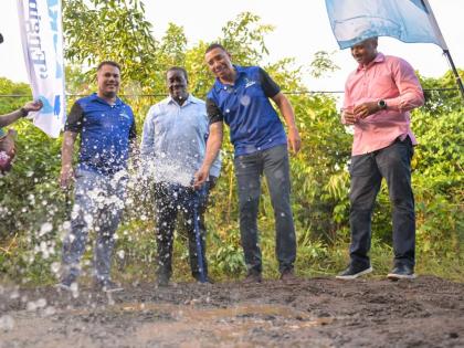 Prime Minister, Dr Andrew Holness (second right), commissions a water supply system during a recent ceremony in St Mary Western. Joining him are (from left) Minister of Water, Environment and Climate Change, Matthew Samuda; Minister without Portfolio in th
