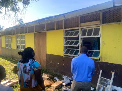 Staff members at Bickersteth Primary and Infant School in St James survey the damage done to a section of the premises, following a break-in at the institution on Wednesday night.