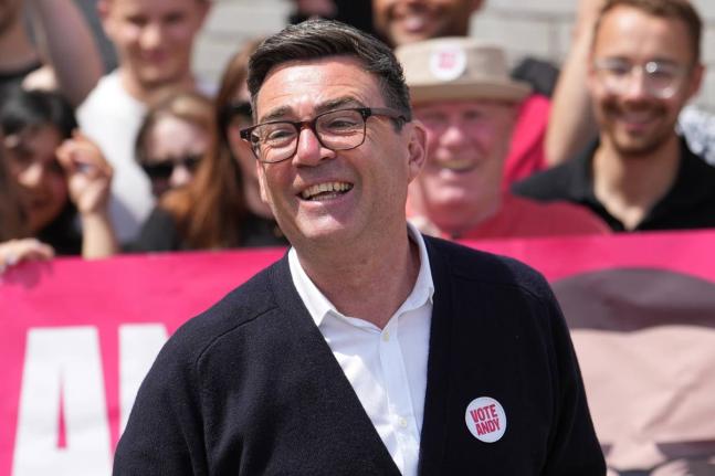  Andy Burnham, Britain’s Labour candidate for Makerfield, speaks in front of supporters during the by-election in Makerfield, England, Thursday, June 18.