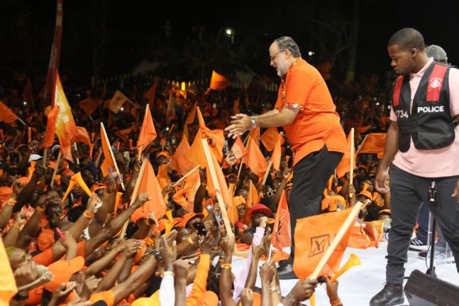 Mark Golding, president of the PNP, greeting supporters at the Cental Jamaica mass meeting held on August 24 ahead of the general election.