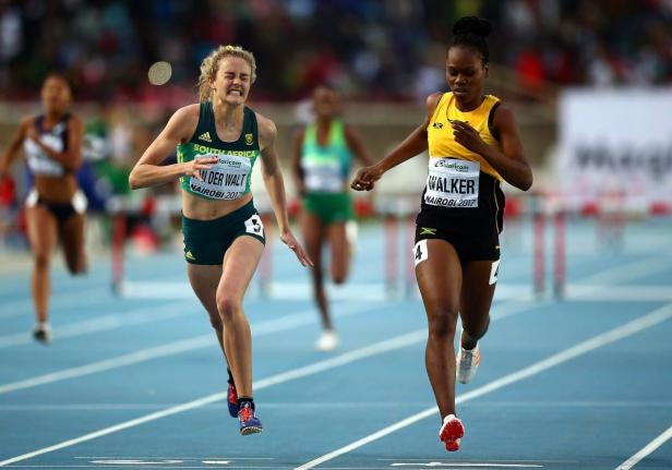 Zeney Van Der Walt of South Africa dips for the finish line ahead of Sanique Walker of Jamaica to win gold in the final of the girls 400m hurdles at IAAF U18 World Championships at the Kasarani Stadium in July 2017 in Nairobi, Kenya.