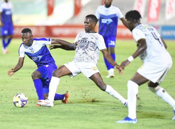 
Franco Celestin (left) from Mount Pleasant is tackled for the ball by Jahmilio Rigters (right) from Cavalier during the Jamaica Premier League final at the National Stadium last season.